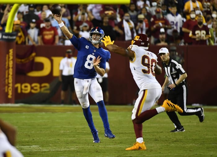Sep 16, 2021; Landover, Maryland, USA; New York Giants quarterback Daniel Jones (8) throws a pass over Washington Football Team defensive end Montez Sweat (90) during the second half at FedExField. Mandatory Credit: Brad Mills-USA TODAY Sports